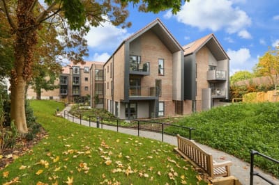 Facility exterior with landscaped outdoor area.