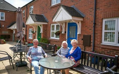 Residents enjoying time outside in a communal area.