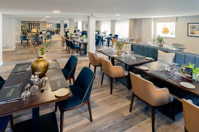 Elegant dining area with tables and chairs