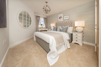 Stylish bedroom interior with soft textures and lighting.