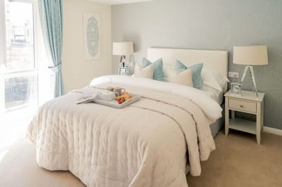 Well-decorated bedroom with breakfast tray