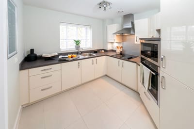 Modern kitchen with white cabinets and appliances