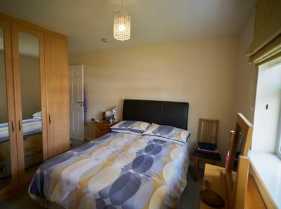 Cozy bedroom with a double bed and furniture