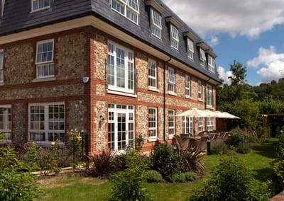 Exterior view of retirement living building with garden