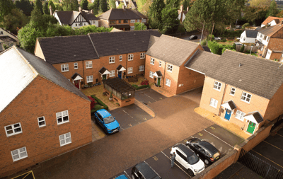 Aerial view of a residential layout with buildings.