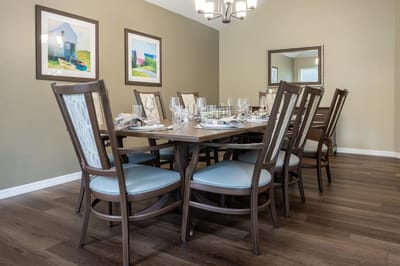A well-set dining room with a large table