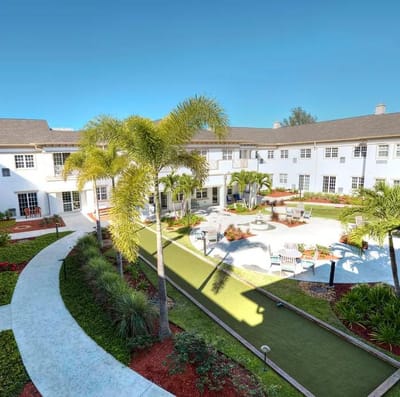 Well-maintained outdoor area with gardens and seating