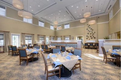 Bright dining room setup with tables and decor