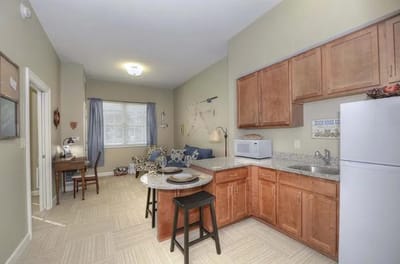 Interior view of a well-furnished resident kitchen area