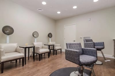 Interior view of a salon area with styling chairs