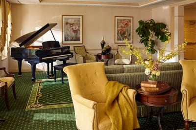 Interior common area with piano and seating