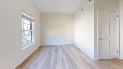 Bright, empty resident room with large window