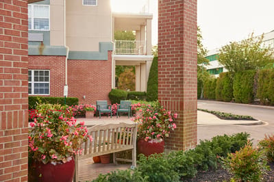 Outdoor seating area with colorful flowers