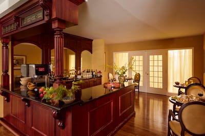 Interior view of a bar area with residents enjoying refreshments