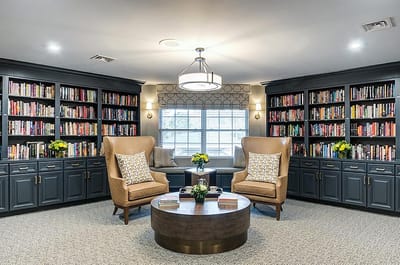 Interior common area with bookshelves and seating