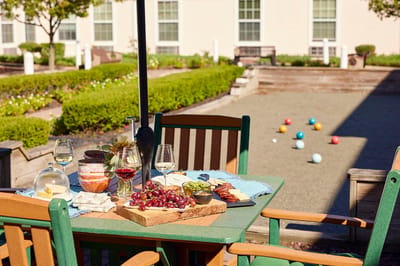 Outdoor dining setup with food and games