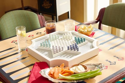 A table set with a game and snack platter