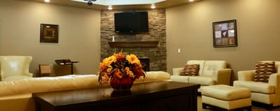 Cozy common area with seating and decorative flowers