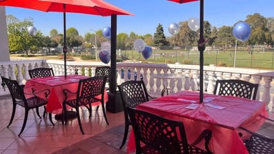 Outdoor dining area with tables and decorations