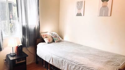 Cozy private room with a bed and decor