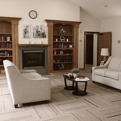Cozy common area with seating and bookshelves