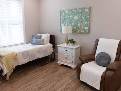 Cozy resident room with light decor and furniture