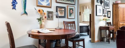 Cozy common area with artwork and a table