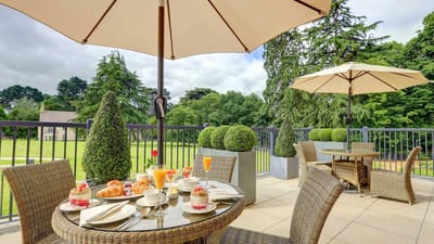Outdoor dining setup with desserts and drinks