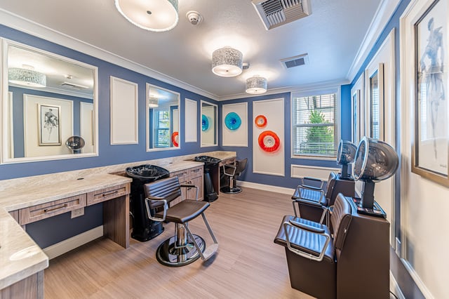 Interior view of a beauty salon with styling stations