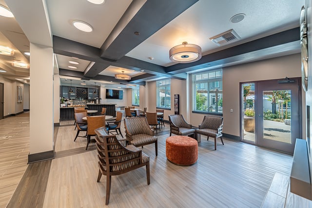 Bright common area with seating and windows