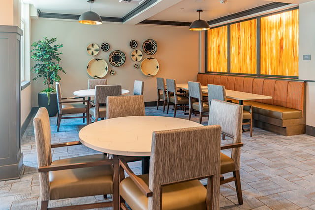 Bright common area with tables and chairs