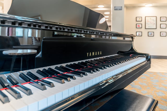 Close-up of a Yamaha piano in a common area