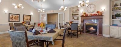 Bright dining room with tables set for meal service