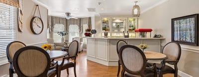Bright common area with dining tables and decor
