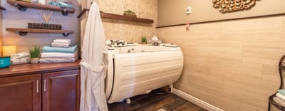 Modern bathroom with a therapeutic tub and towels