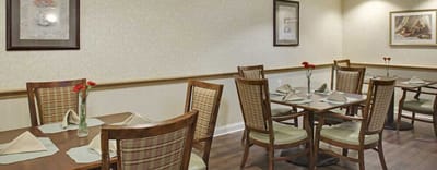 Dining area with tables and floral centerpieces