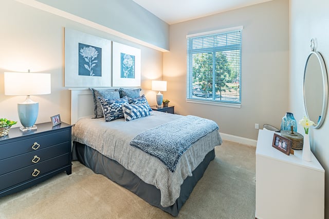 Cozy bedroom with a bed and decorative artwork