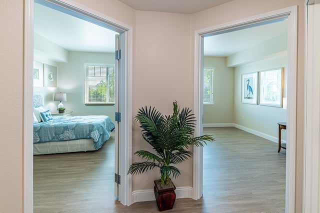 Hallway view leading to two resident rooms
