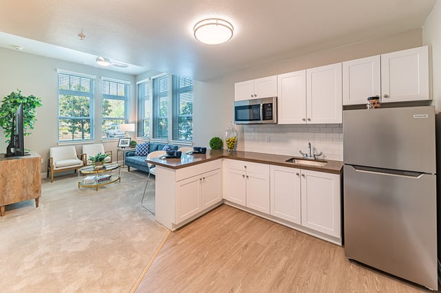 Bright, modern common area with a kitchenette and seating