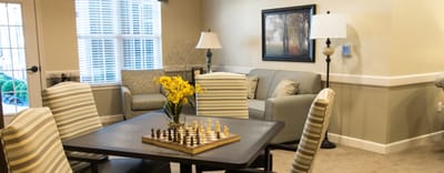 Comfortable common area with seating and a chess set