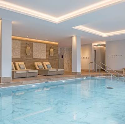 Interior view of a calming spa area with a pool.