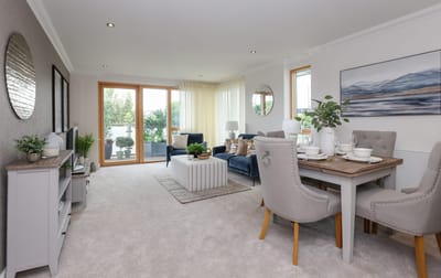 Bright and modern common area with seating and dining table