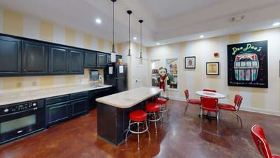 Interior view of a dining area with red chairs