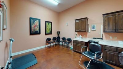 Interior view of a therapy room with exercise equipment