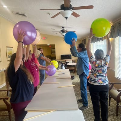 Residents engaging in a fun balloon activity