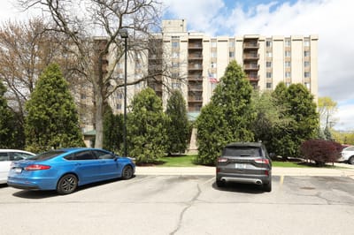 Exterior view of Maple Heights Senior Living with cars in parking lot