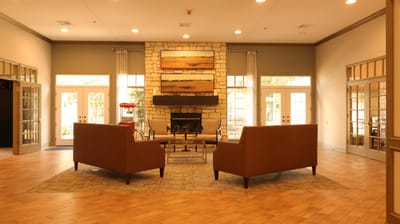 Cozy common area with comfortable seating and a fireplace