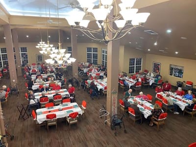 Residents enjoying a community meal in the dining room