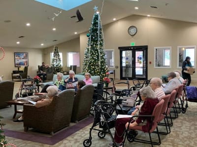 Residents relaxing in a common area during the holiday season