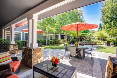 Outdoor seating area with umbrellas and flowers